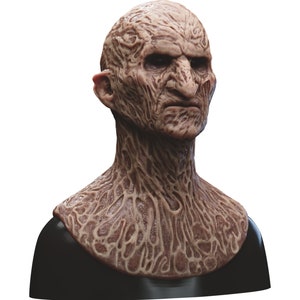 May include: A detailed, realistic, and grotesque mask of a creature with a wrinkled, brown, and textured face. The mask is made of a flexible material and is designed to be worn over the head.