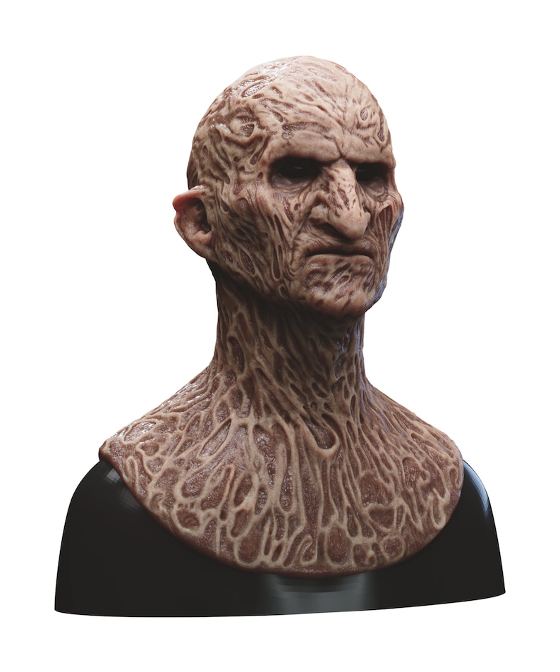 May include: A detailed, realistic, and grotesque mask of a creature with a wrinkled, brown, and textured face. The mask is made of a flexible material and is designed to be worn over the head.
