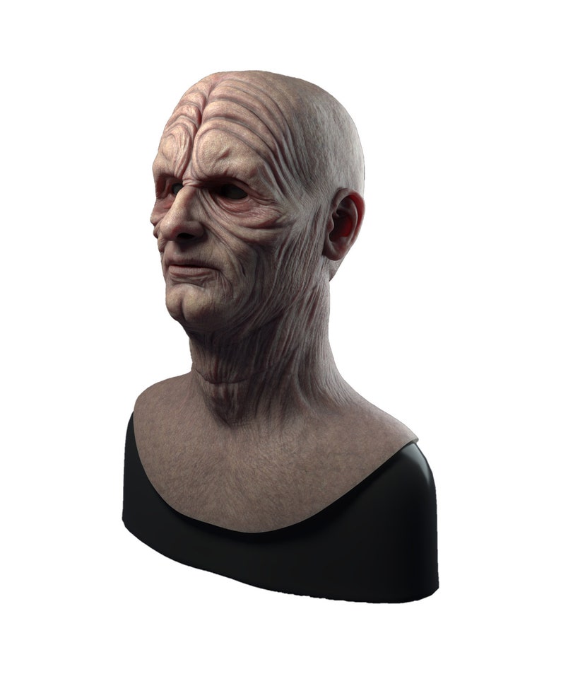 May include: A detailed bust sculpture of a fictional character with wrinkled skin and a serious expression. The bust is mounted on a black base.