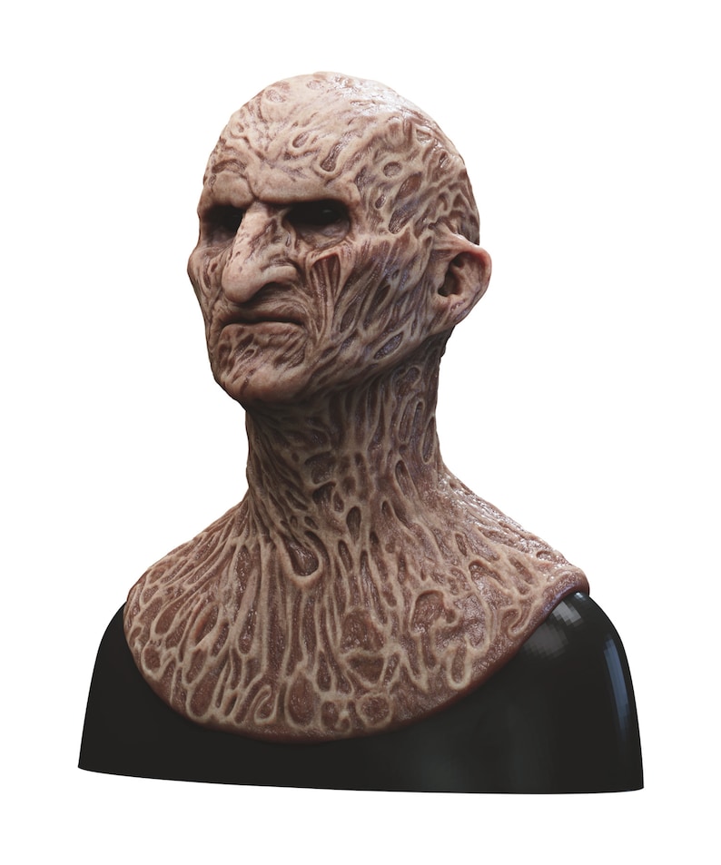 May include: A detailed, realistic, and grotesque mask of a burned human face and neck. The mask is made of a flesh-toned silicone material and features a textured surface that resembles burned skin. The mask is mounted on a black stand.