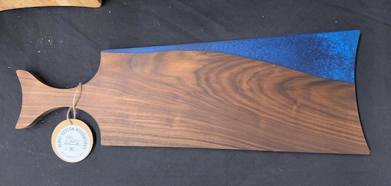 Live edge walnut and epoxy charcuterie board