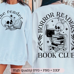 May include: A light blue sweatshirt with a black and white graphic of a skull reading a book. The text "the reader" is above the skull. The back of the sweatshirt has a black and white graphic of a skeleton reading a stack of books. The text "HORROR READERS BOOK CLUB" is below the skeleton.