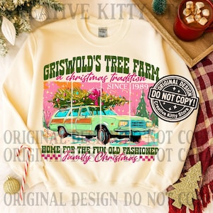 May include: Cream-colored sweatshirt with a graphic featuring a green station wagon carrying a Christmas tree. The graphic includes text that reads "Griswold's Tree Farm, a Christmas tradition since 1989" and "Home for the fun old fashioned family Christmas."
