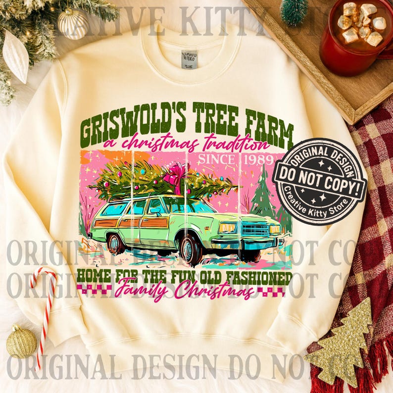 May include: Cream-colored sweatshirt with a graphic featuring a green station wagon carrying a Christmas tree. The graphic includes text that reads "Griswold's Tree Farm, a Christmas tradition since 1989" and "Home for the fun old fashioned family Christmas."