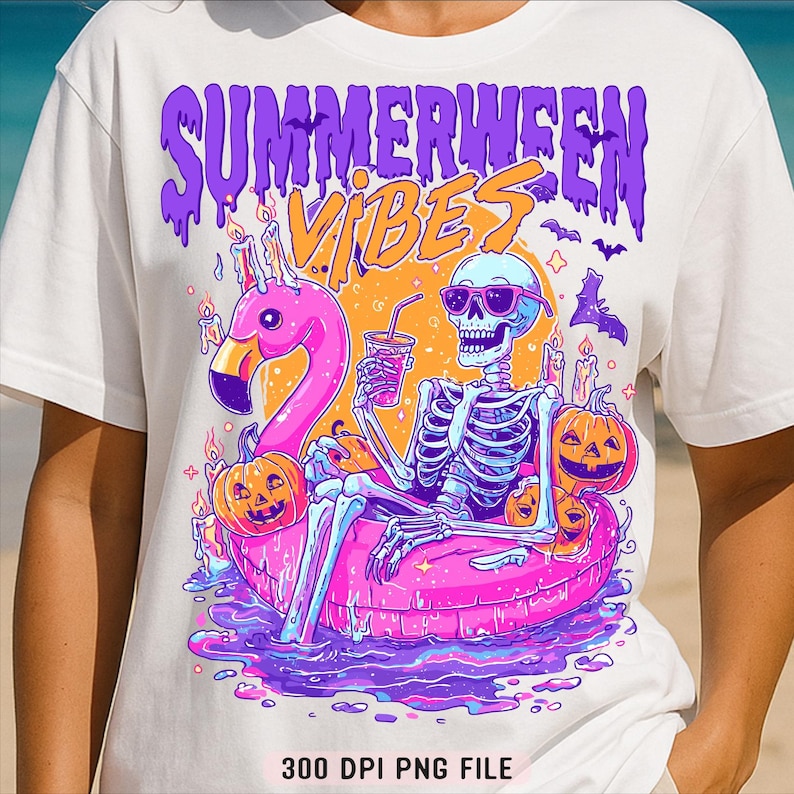 May include: White t-shirt with a colourful graphic featuring a skeleton in sunglasses relaxing on a pink flamingo floatie. The design includes pumpkins, bats, and the words "Summerween Vibes" in purple and orange.