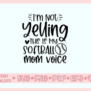 May include: Black and white graphic design with the text "I'm Not Yelling This Is My Softball Mom Voice" and a softball graphic.