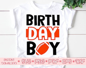 May include: White t-shirt with black text that says "Birthday Boy" and a football graphic. The word "Day" is in orange.