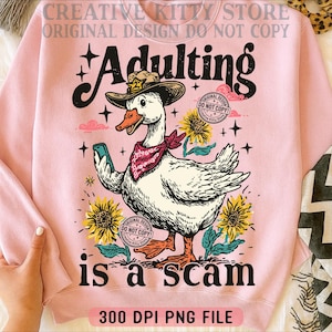 May include: Pale pink sweatshirt featuring a cartoon goose in a cowboy hat and bandana, holding a phone. The text "Adulting is a scam" is below the goose, with sunflowers and stars. The words "Original Design Do Not Copy" are also visible.