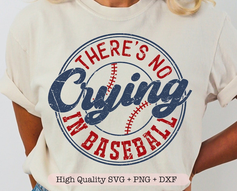 May include: A white t-shirt with a blue and red circle graphic that says "There's No Crying In Baseball".