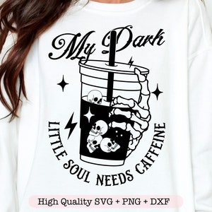 May include: A white sweatshirt with black text that reads "My Dark Little Soul Needs Caffeine" and a graphic of a black coffee cup with skulls inside.