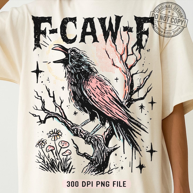 May include: Cream-colored t-shirt featuring a black crow perched on a tree branch, with the text "F-CAW-F" above. The crow has pink accents, and the design includes stars, flowers, and the text "300 DPI PNG FILE".
