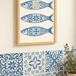 Azulejo sardine wall art above blue patterned tiles, Mediterranean bathroom coastal decor.