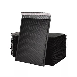 May include: A stack of black padded mailing envelopes with a silver lining. The envelopes are made of bubble wrap material and have a self-sealing adhesive strip.