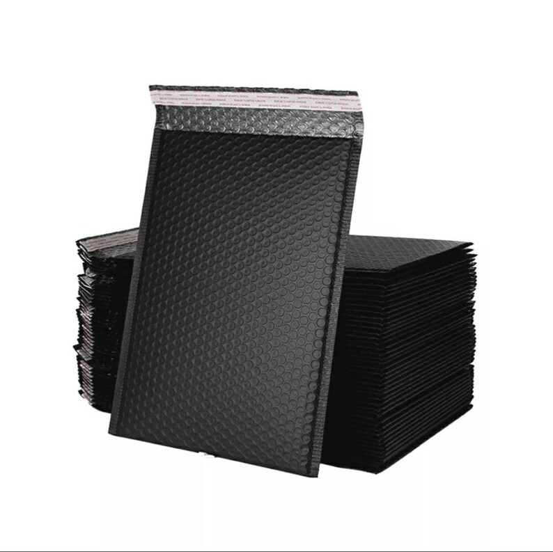 May include: A stack of black padded mailing envelopes with a silver lining. The envelopes are made of bubble wrap material and have a self-sealing adhesive strip.