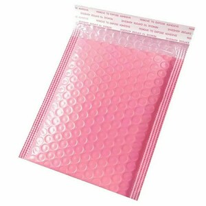 May include: Pink bubble mailer with a clear plastic adhesive strip. The adhesive strip has the text "REMOVE TO EXPOSE ADHESIVE" printed on it.