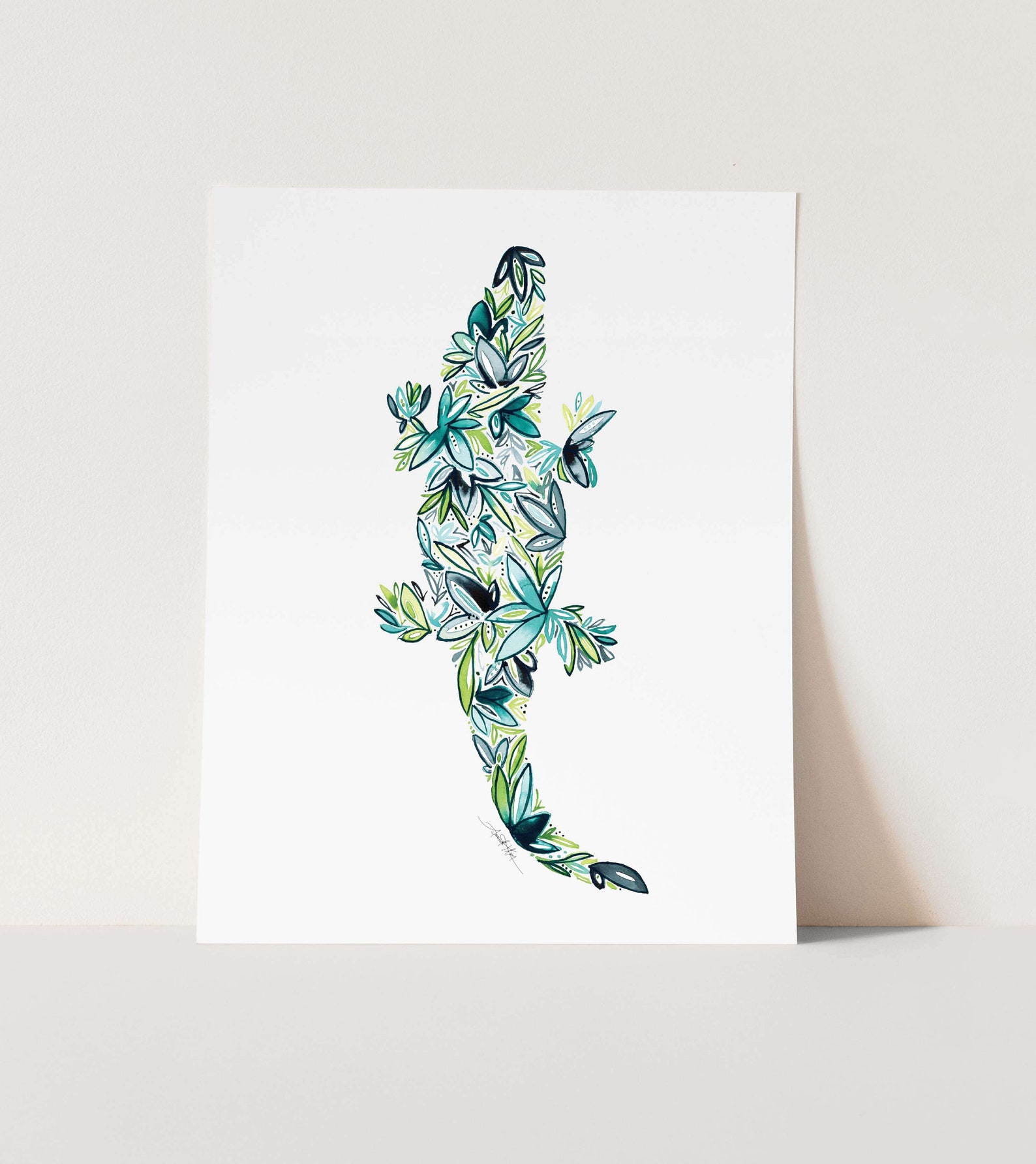 white piece of paper with an alligator made of flowers drawn on it