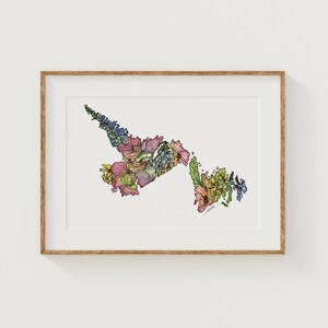 May include: A framed art print featuring a colorful floral illustration in the shape of a Canadian province. The artwork showcases a variety of flowers in shades of pink, yellow, blue, and green, set against a white background.