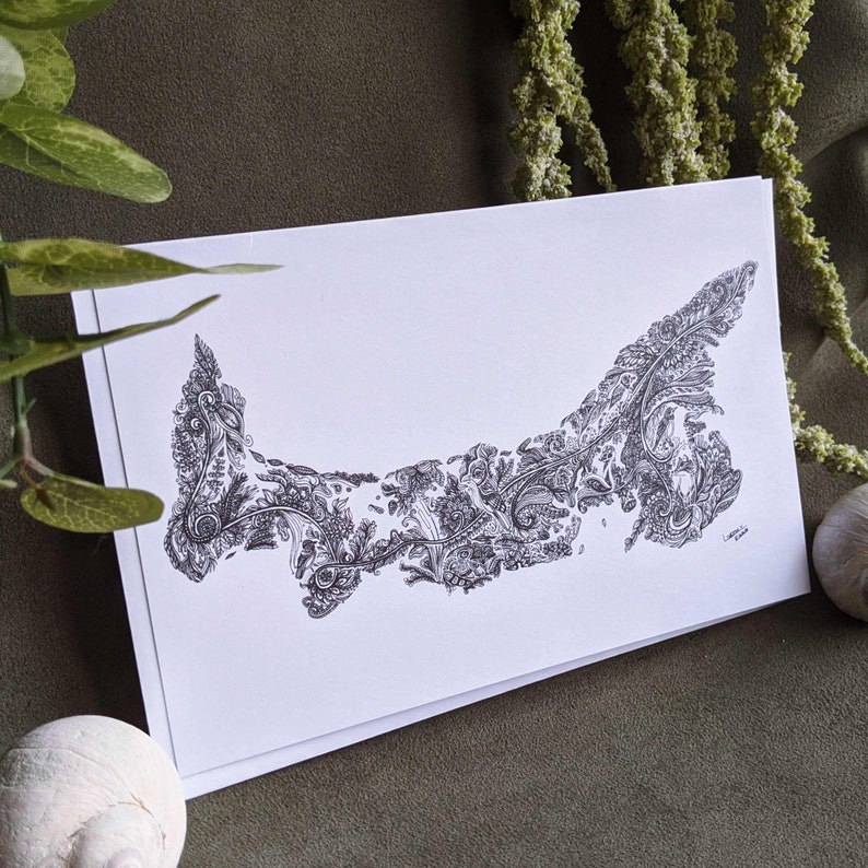 May include: A black and white line drawing of Prince Edward Island, Canada, with a detailed, intricate design of swirling patterns and foliage.