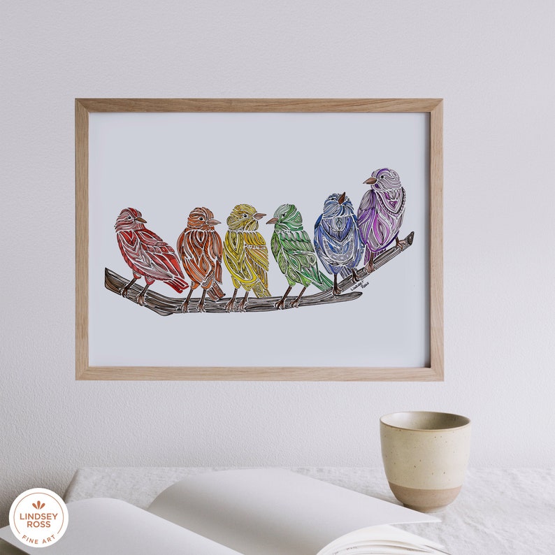 May include: A framed print of a rainbow-colored bird illustration. Seven birds are perched on a branch, each bird a different color of the rainbow. The birds are stylized and detailed, with intricate patterns and textures.