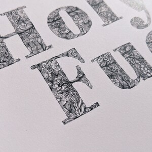 May include: A black and white illustration of the word "HOLIDAY FUN" with intricate floral and doodle designs.