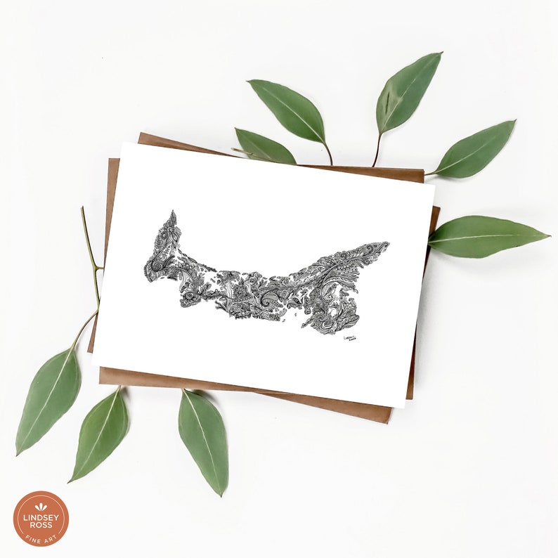 May include: A black and white line drawing of Prince Edward Island, Canada, with a paisley pattern. The drawing is on a white card with a brown paper backing.