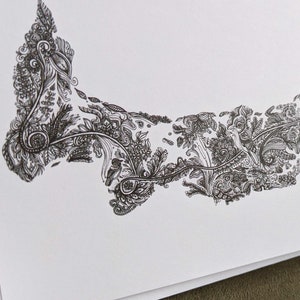 May include: A black and white line drawing of a stylized floral design in the shape of the Canadian province of Prince Edward Island.