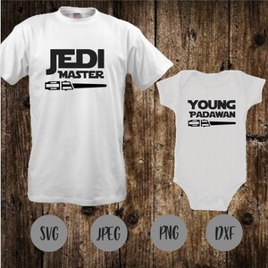 May include: White t-shirt with black text that reads "Jedi Master" and a lightsaber graphic. A white baby onesie with black text that reads "Young Padawan" and a lightsaber graphic. The shirts are on a wood background with the words "SVG", "JPEG", "PNG", and "DXF" in gray circles.