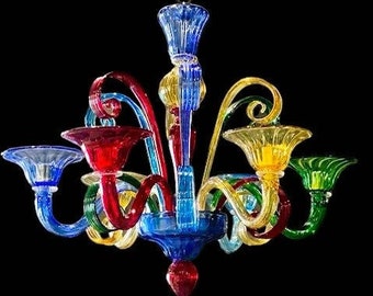 May include: A colorful glass chandelier with multiple arms and a central drop. The chandelier features a mix of blue, red, yellow, and green glass.