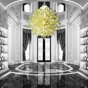 May include: A large, yellow glass chandelier hangs from the ceiling of a grand, white entryway with black and white marble floors. The chandelier has a unique, organic shape with many curved arms.