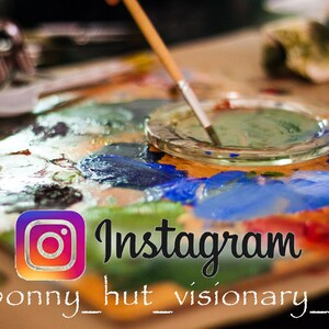 May include: A wooden artist's palette with a variety of colourful paint splotches, a clear glass dish with green paint, and a paintbrush. The Instagram logo and text are visible, with the handle @bonny_hut_visionary_art.