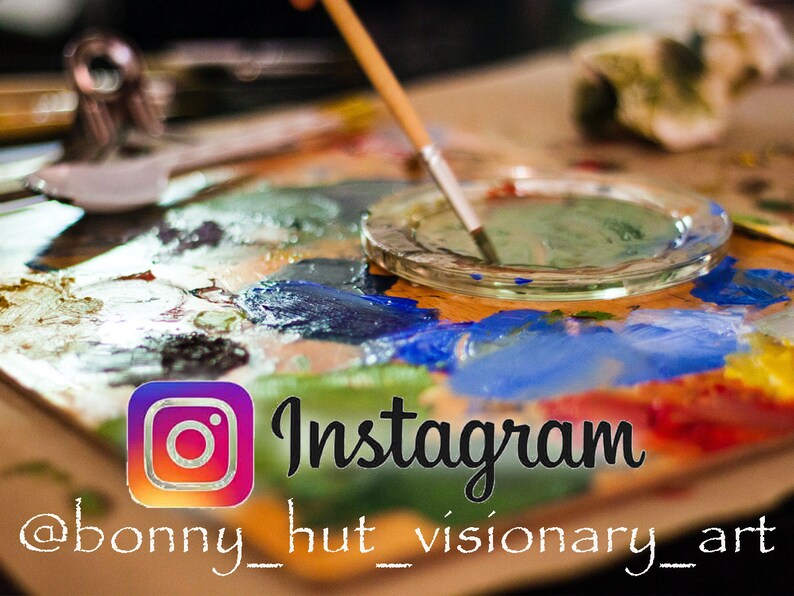 May include: A wooden artist's palette with a variety of colourful paint splotches, a clear glass dish with green paint, and a paintbrush. The Instagram logo and text are visible, with the handle @bonny_hut_visionary_art.