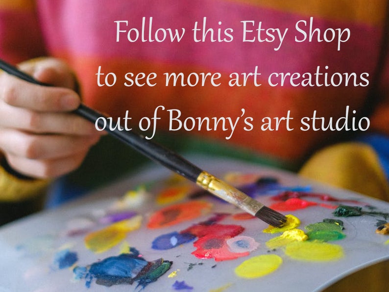 May include: A paintbrush with yellow paint on the bristles rests on a palette with various colours. The text reads "Follow this Etsy Shop to see more art creations out of Bonny's art studio."