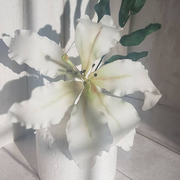 Realistic sugar gumpaste 8 inch stunning open lily. This creates a beautiful statement on any cake.