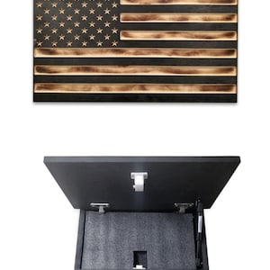 May include: A wooden American flag with a hidden compartment that opens to reveal a storage space. The compartment is lined with black foam and has a gas strut to help it open.
