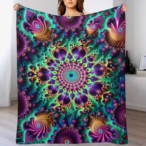 May include: A vibrant, colorful blanket with a fractal design. The blanket features a central circular pattern with swirling details in shades of purple, green, yellow, and blue. The overall design is intricate and eye-catching, perfect for adding a pop of color to any room.