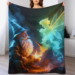 May include: A plush blanket featuring a whimsical illustration of a gnome smoking a pipe, with a fairy made of colorful smoke. The gnome wears a blue hat and holds a glowing bowl. The background is dark with colorful smoke.