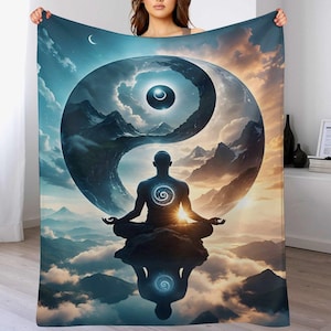 May include: A large, rectangular blanket featuring a serene illustration of a meditating figure in a lotus position. The design includes a Yin Yang symbol, mountains, clouds, and a celestial background with a crescent moon.