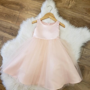 Blush satin and tulle flower girl dress. Classic yet elegant.