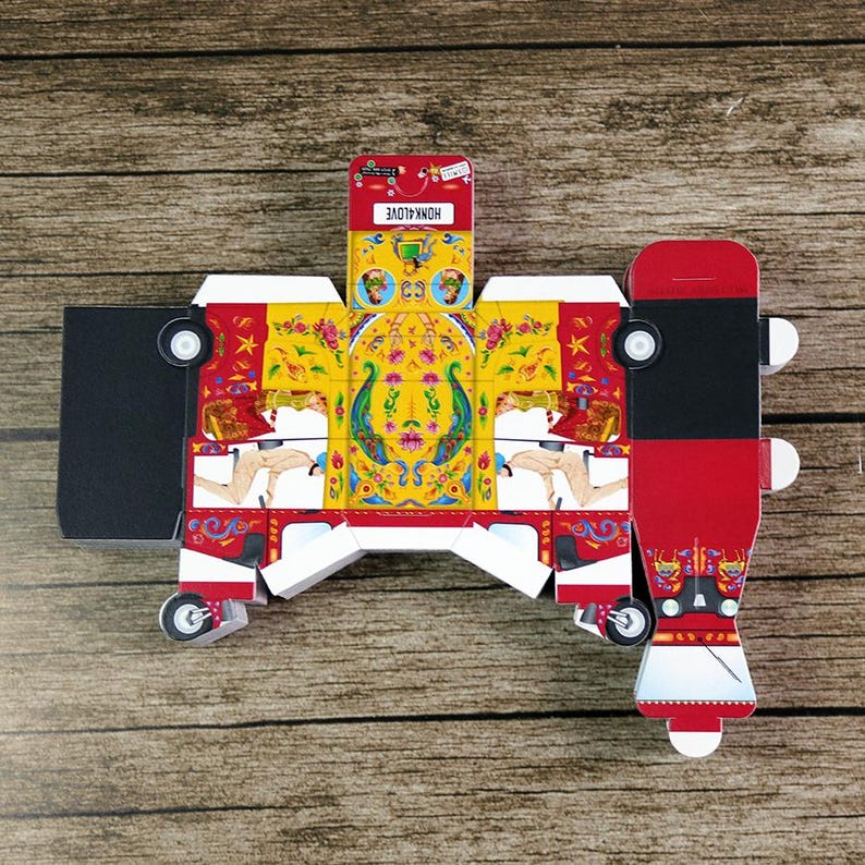 A flat, unassembled red rickshaw box sheet with a completed 3D box beside it, demonstrating the easy fill-and-assemble concept.