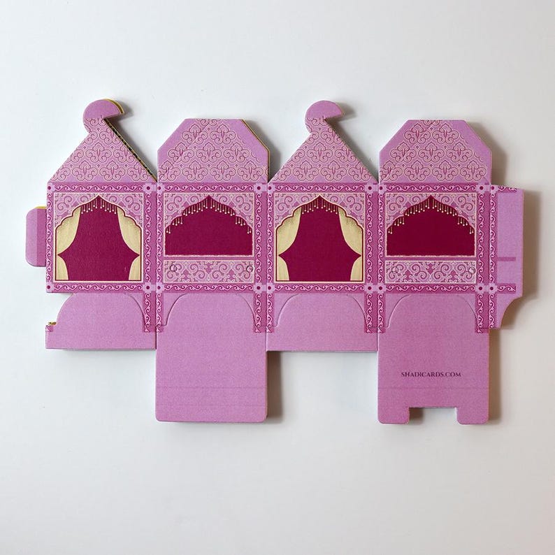 A stack of flat, unassembled doli box templates, showing they are easy to store.