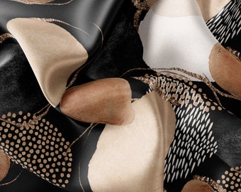 Tela artesanal con estampado de círculos en negro y beige: satén, gasa, crepé.