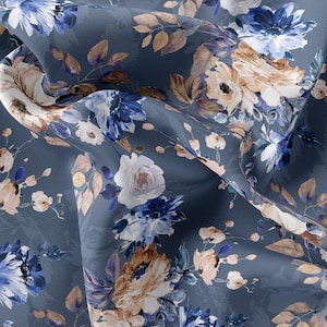 May include: A blue fabric with a floral pattern. The flowers are in shades of blue, white, and brown. The fabric is soft and flowing.