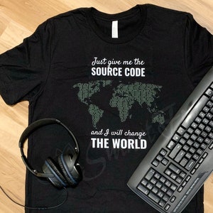 May include: Black t-shirt with a world map made of code and the text "Just give me the source code and I will change the world".