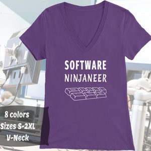 May include: Purple V-neck t-shirt with the text "SOFTWARE NINJANEER" and a white outline of a computer keyboard.
