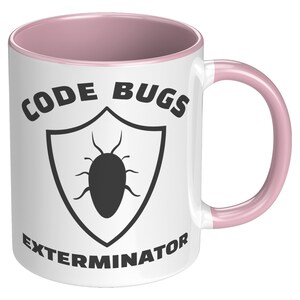 May include: White ceramic coffee mug with a pink rim and handle. The mug features a black and white graphic of a shield with a bug inside. The text "CODE BUGS EXTERMINATOR" is printed on the mug.
