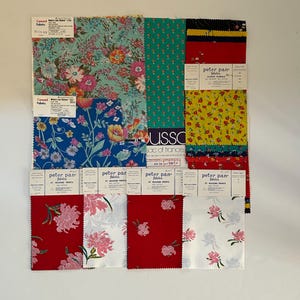May include: A selection of fabric swatches featuring floral designs in a range of colours, such as teal, blue, yellow, and red. Some swatches are labelled with "Concord Fabrics" and "Peter Pan Fabrics".