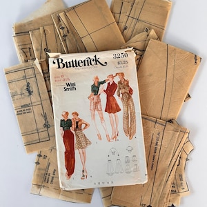 May include: A Butterick 3250 sewing pattern envelope for size 8, bust 31.5 inches, featuring Willi Smith designs. The envelope displays illustrations of three outfits and is surrounded by multiple tan, translucent tissue paper pattern pieces.