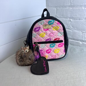 betsey johnson mini convertible backpack Women's Clear in Dots Exterior features a quilted zip pocket at front Luv Betsey Johnson Cutie Bot