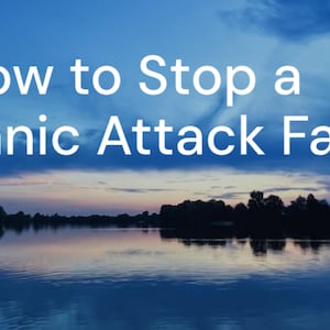 May include: Image with text that reads "How to Stop a Panic Attack Fast" in white letters against a backdrop of a lake and sky. The sky transitions from blue to shades of pink and purple.