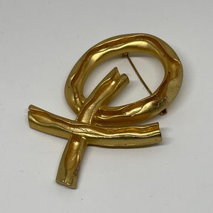 Vintage goldtone AJC brooch